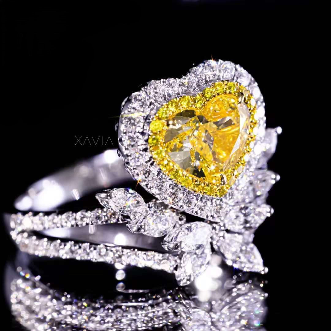 side profile view of heart-shaped fancy yellow diamond engagement ring with double halo and marquise white diamonds